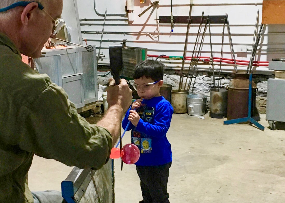 young child glassblowing