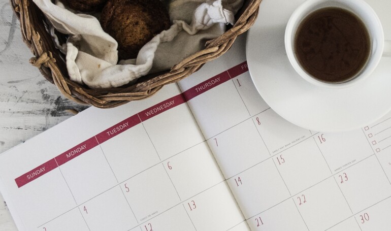 calendar with mug and basket of pastries