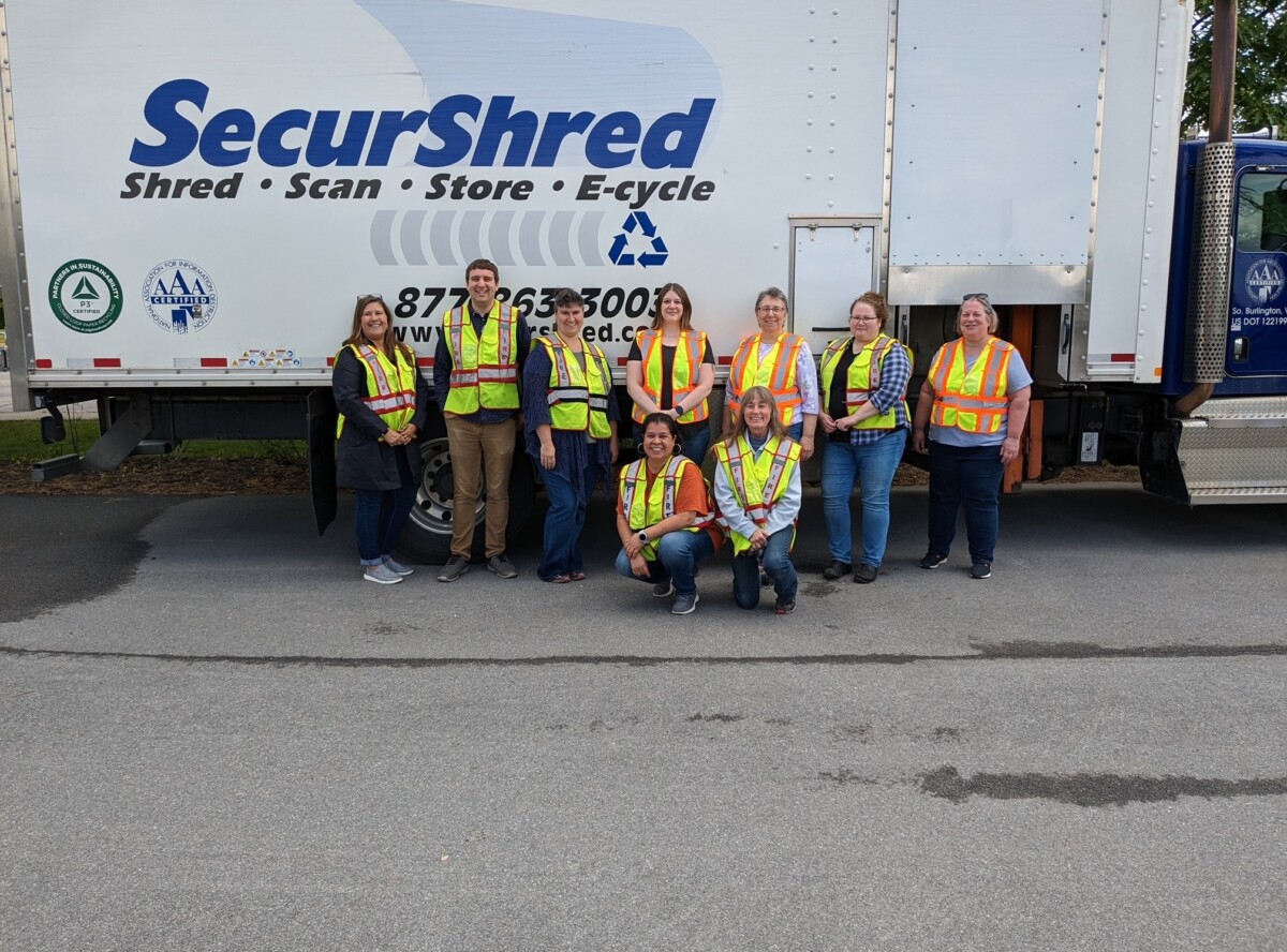 SecureShred truck with NBM employees in front