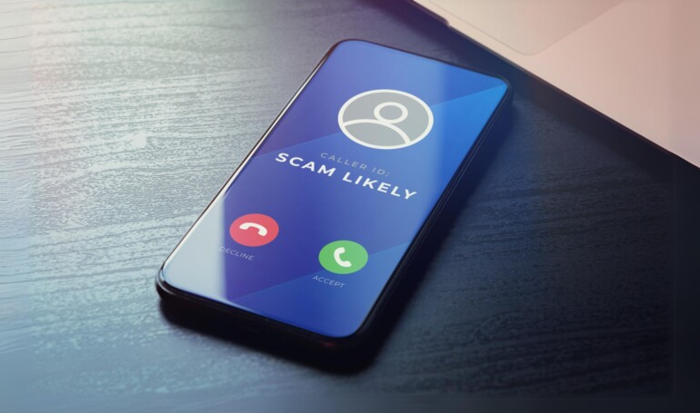 smart phone with "likely spam call" on screen